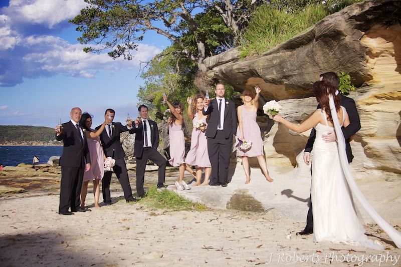 Cheers from the bridal party at Balmoral Beach - wedding photography sydney
